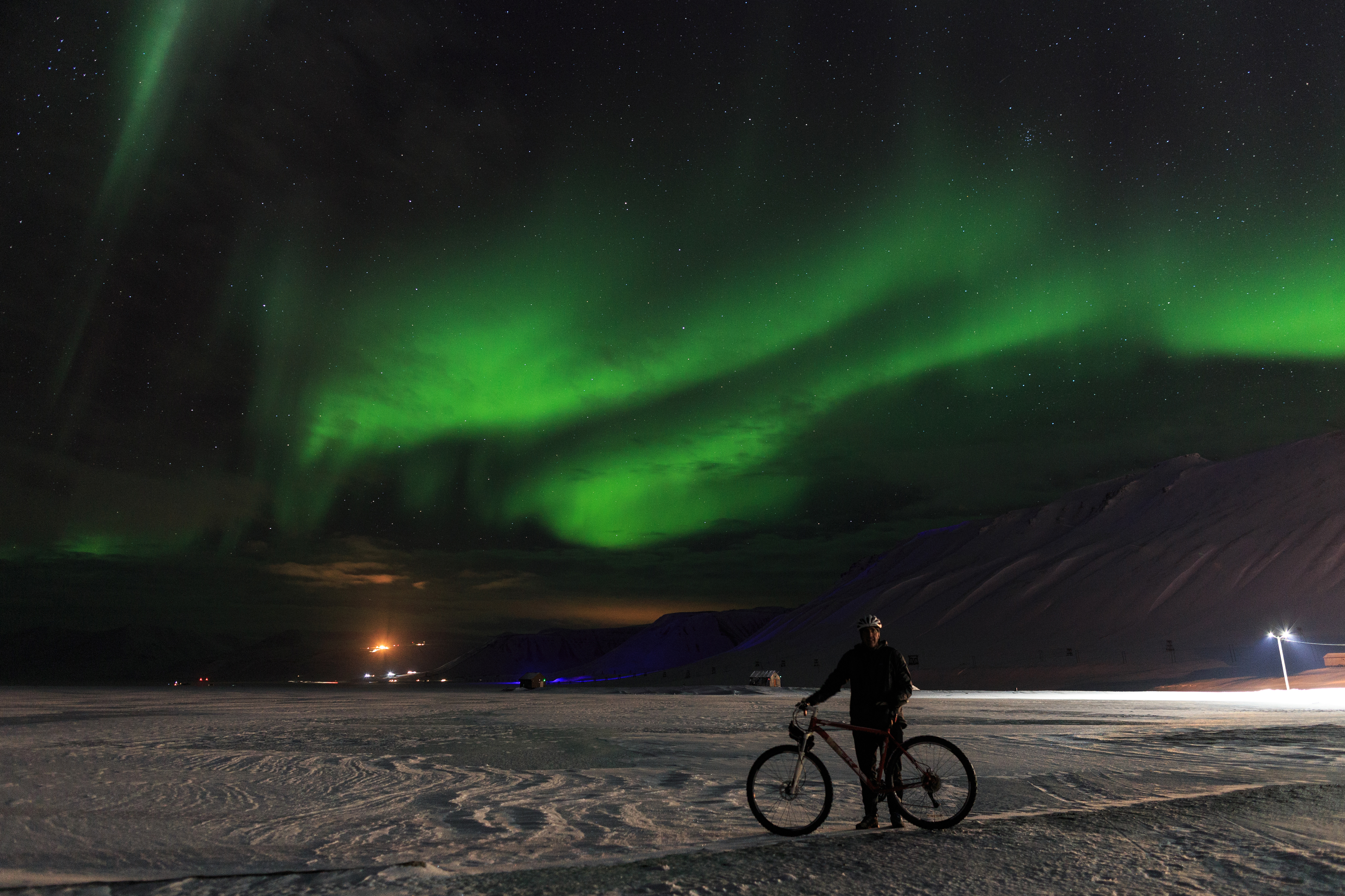Biking under the Northern Lights - John Cassano